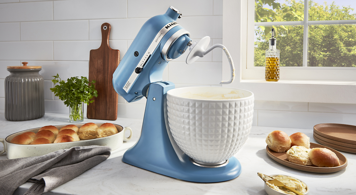 A blue KitchenAid® stand mixer used to make rolls