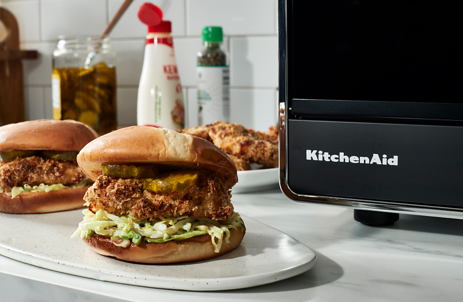 Air fryer chicken katsu sandwiches next to KitchenAid® countertop oven