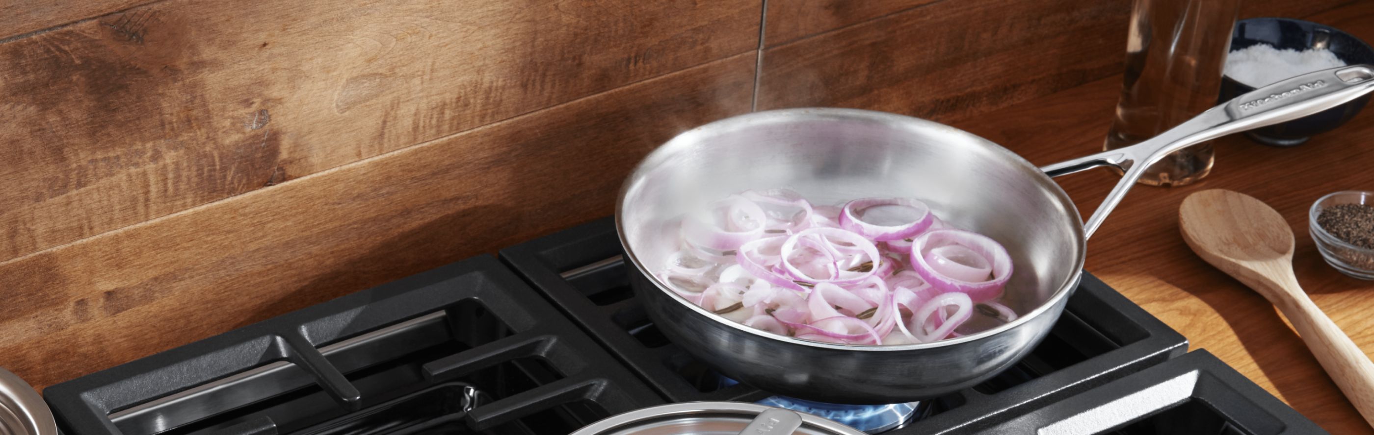 Onions cooking in KitchenAid® cookware