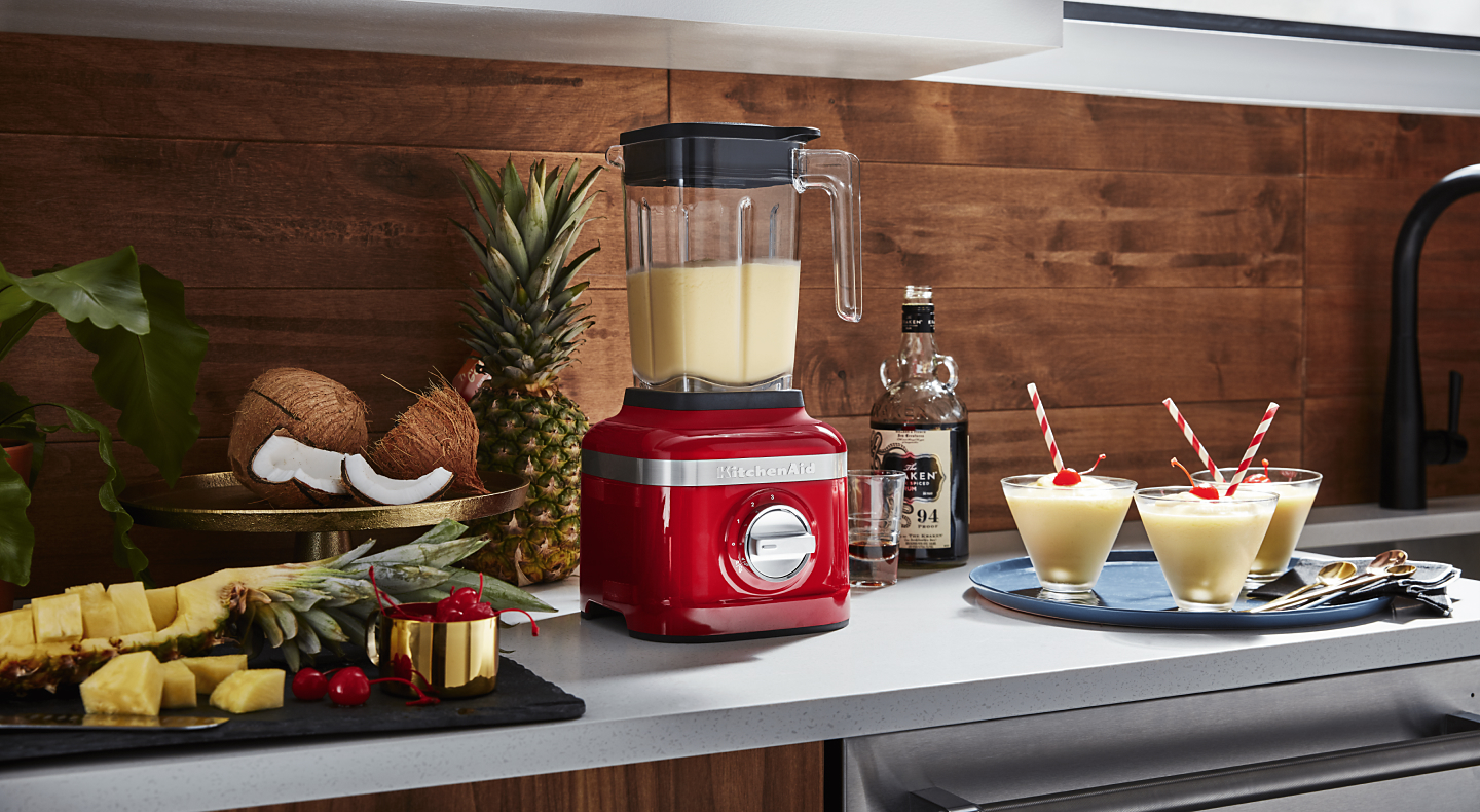 Red KitchenAid® blender filled with smoothie