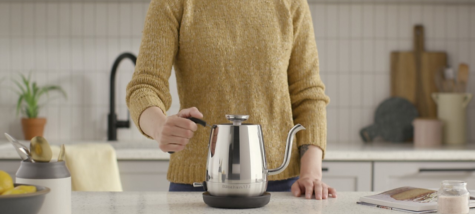 A gooseneck electric kettle on a kitchen countertop