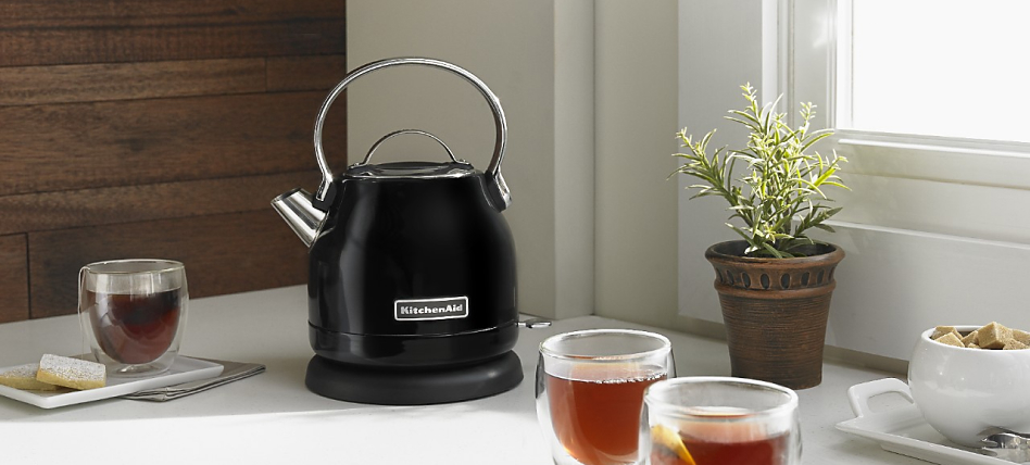 Test Black electric tea kettle on a countertop next to full glasses of tea