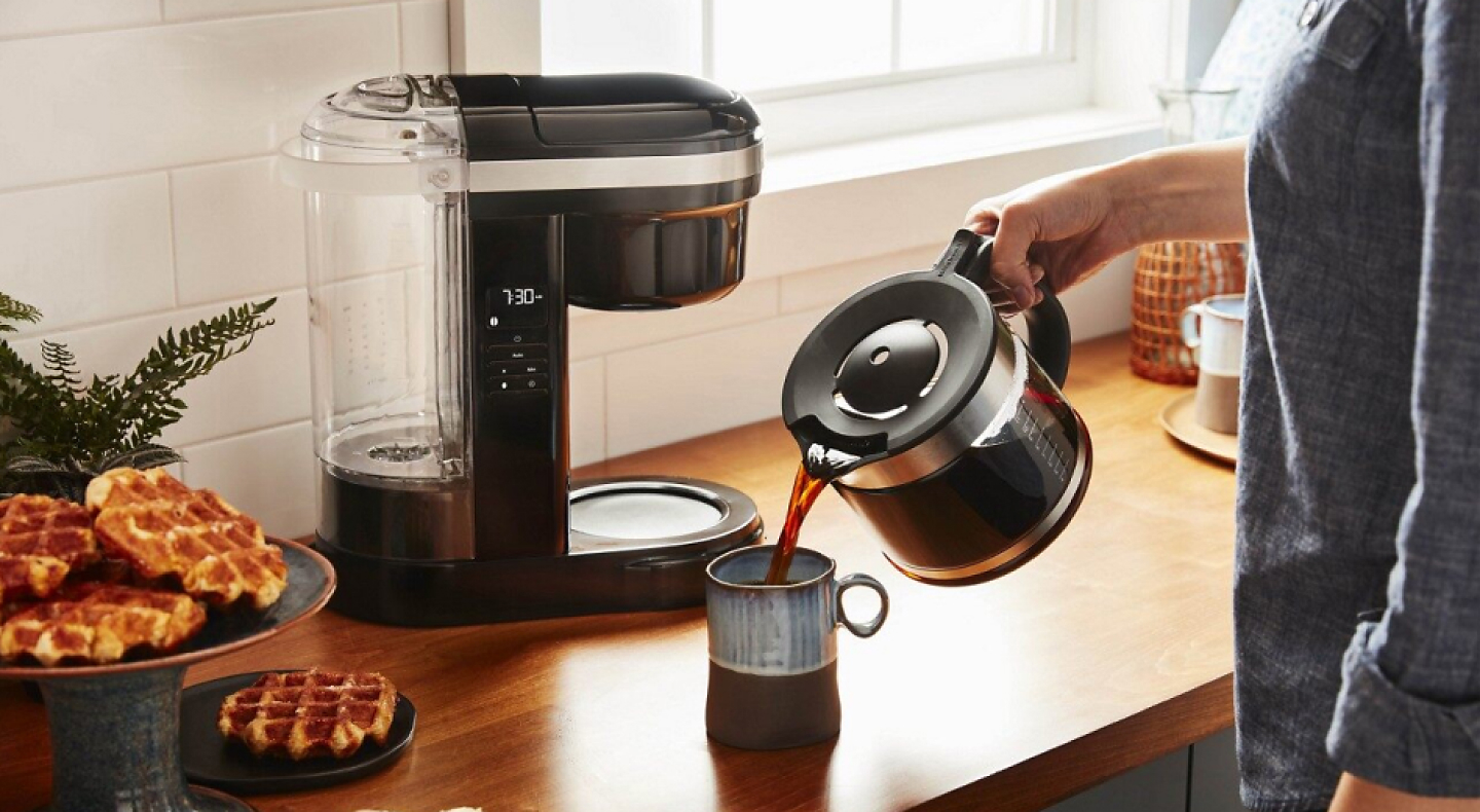 https://kitchenaid-h.assetsadobe.com/is/image/content/dam/business-unit/kitchenaid/en-us/marketing-content/site-assets/page-content/pinch-of-help/how-to-clean-and-descale-a-coffee-maker/Ihow-to-clean-and-descale-a-coffee-maker-1-Desktop.jpg?fmt=png-alpha&qlt=85,0&resMode=sharp2&op_usm=1.75,0.3,2,0&scl=1&constrain=fit,1