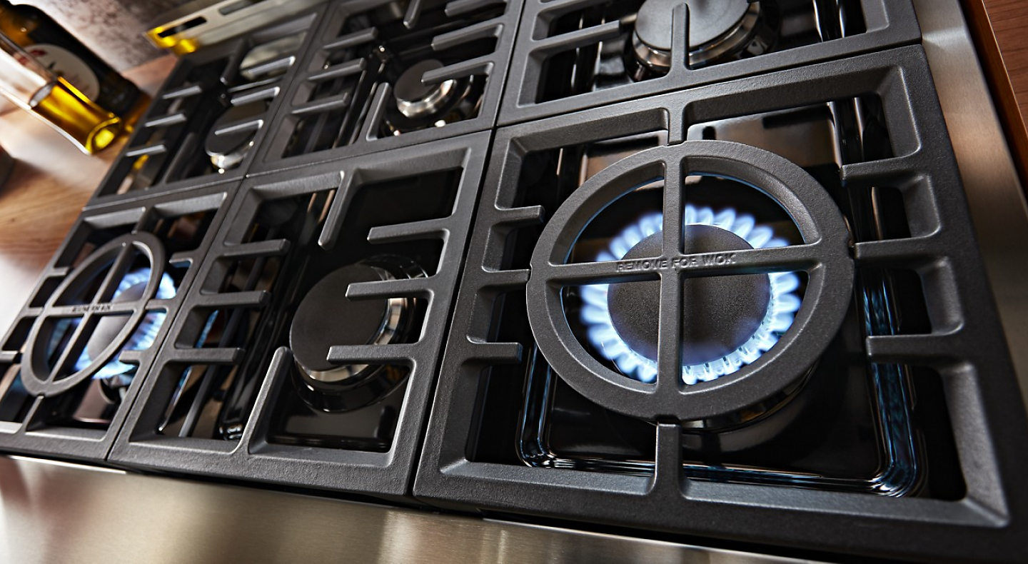 A gas stovetop with two activated burners