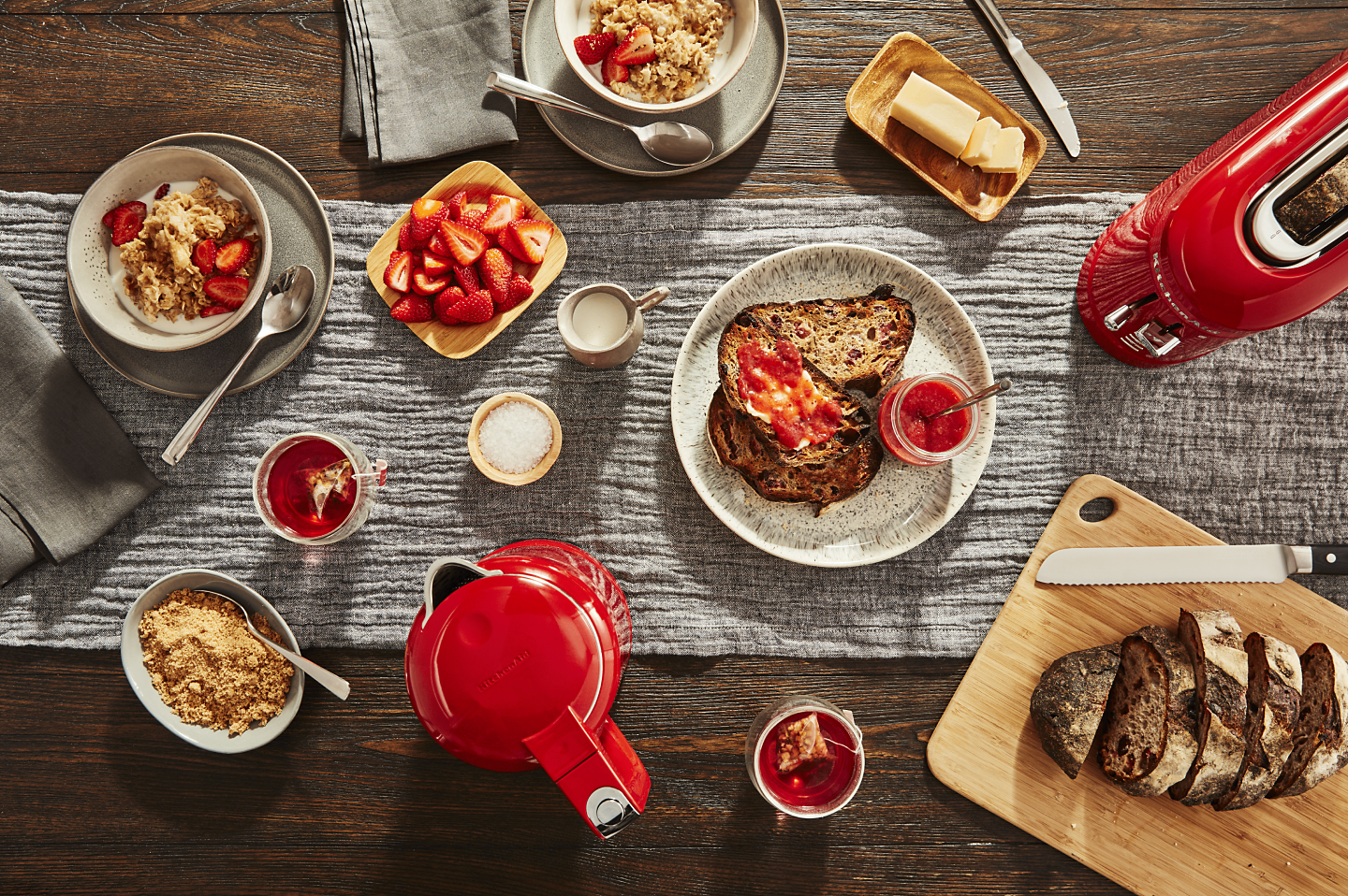 Breakfast foods next to red KitchenAid® countertop appliances