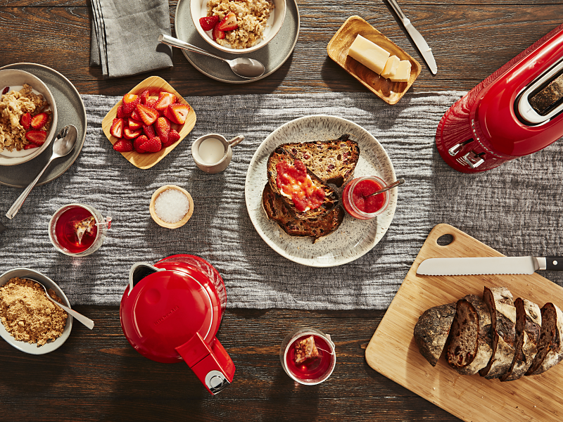 Breakfast foods next to red KitchenAid® countertop appliances