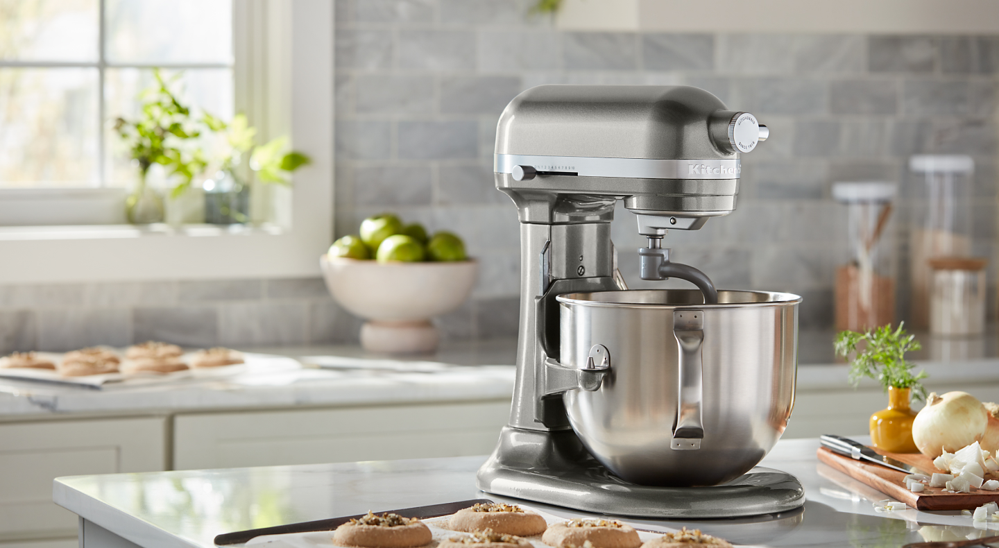 Silver bowl lift KitchenAid® stand mixer on counter with baked cookies