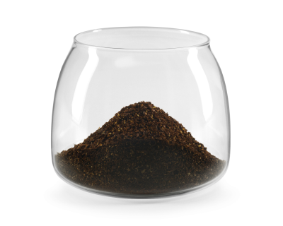 Clear glass with freshly ground coffee