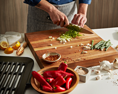 Person prepping ingredients on a cutting board