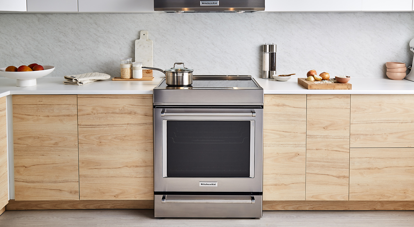 A stainless steel KitchenAid® slide-in range in a modern kitchen