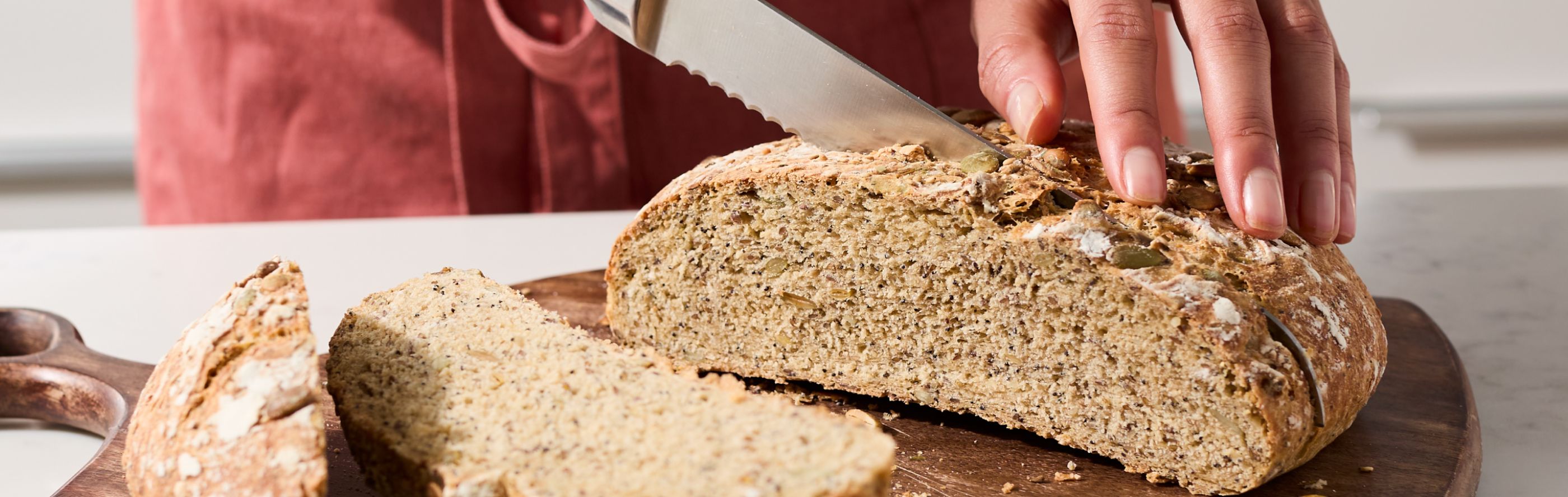 Cutting a homemade seed bread