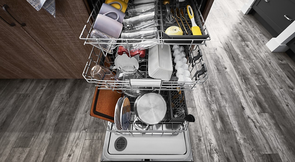 View of a loaded dishwasher with its door open