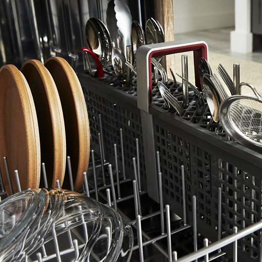Dishwasher rack full of dishes and cookware