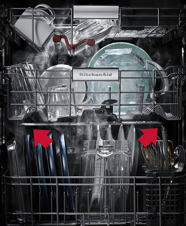 Interior view of a loaded dishwasher 