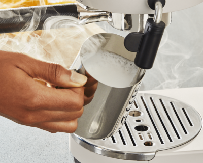Milk being frothed with a milk frother