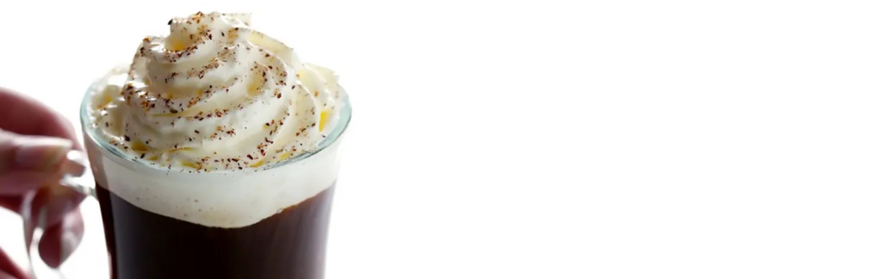 Irish coffee topped with whipped cream and chocolate flakes