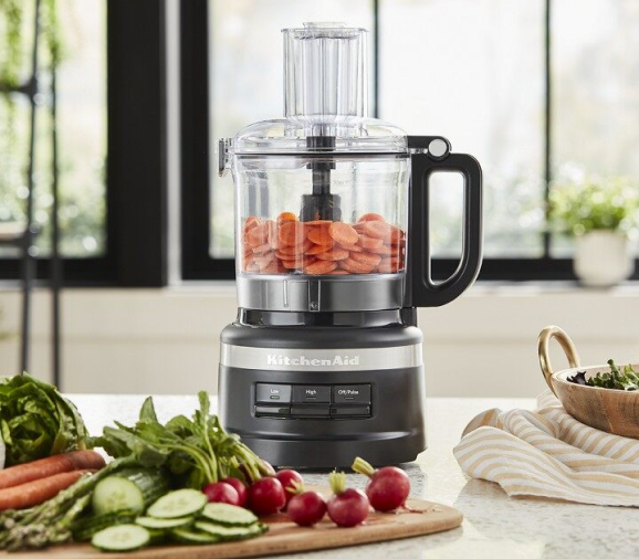 Black KitchenAid® food processor with sliced carrots for baby food