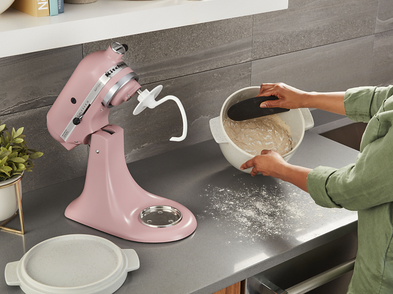 Scraping dough from a mixer bowl