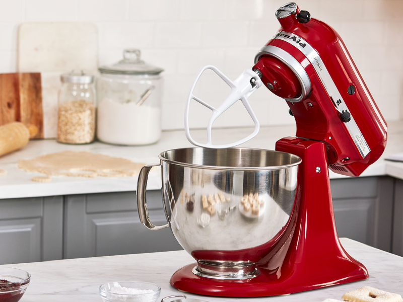 Red KitchenAid® tilt-head stand mixer with the KitchenAid® Flat Beater accessory attached