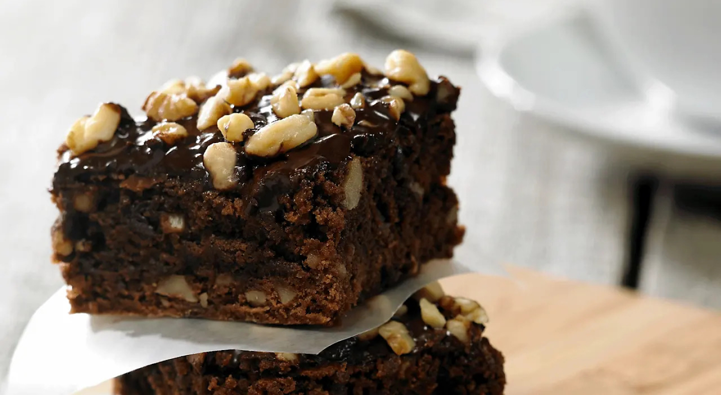 Chocolate and walnut brownies topped with chopped nuts