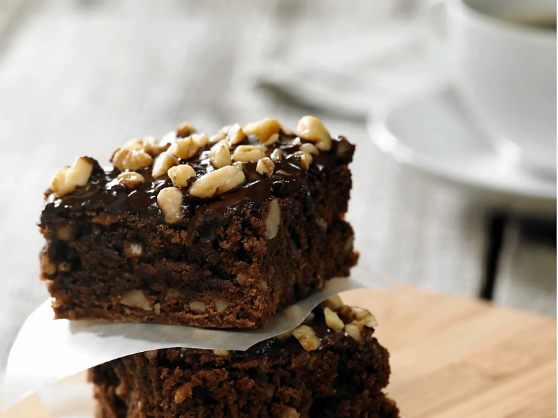 Chocolate and walnut brownies topped with chopped nuts
