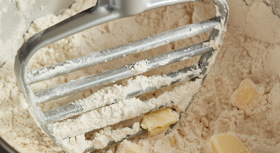 KitchenAid® Pastry Beater cutting butter into flour