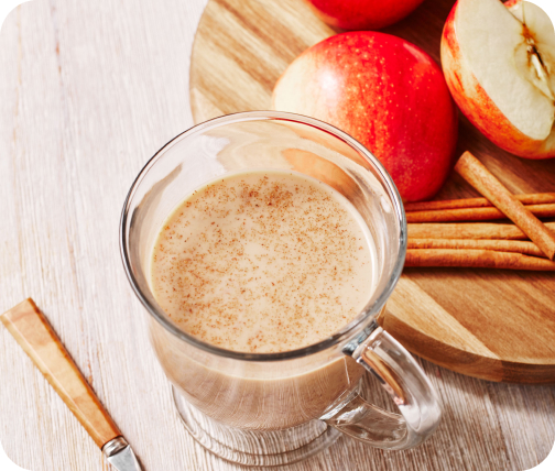 Glass of hot cold brew latte with apples