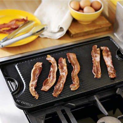 Bacon frying on a griddle