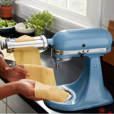  KitchenAid® stand mixer with KitchenAid® Roller Attachment making rolling out sheet of pasta