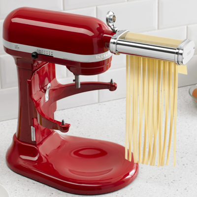 KitchenAid® Pasta Cutter Attachment cutting pasta dough into thick noodles