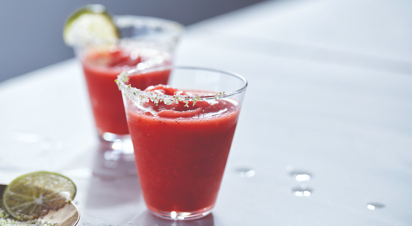 Strawberry margaritas in glasses with sugared rim