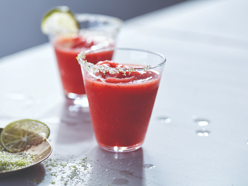 Strawberry margaritas in glasses with sugared rim