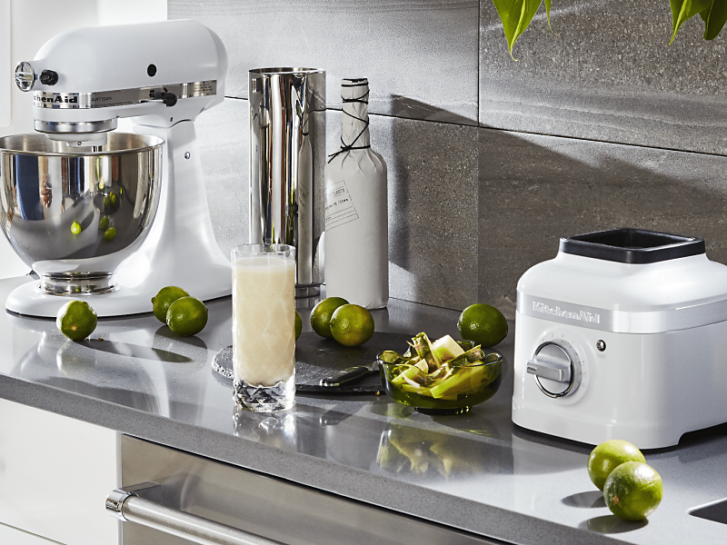 White KitchenAid® blender and stand mixer on countertop