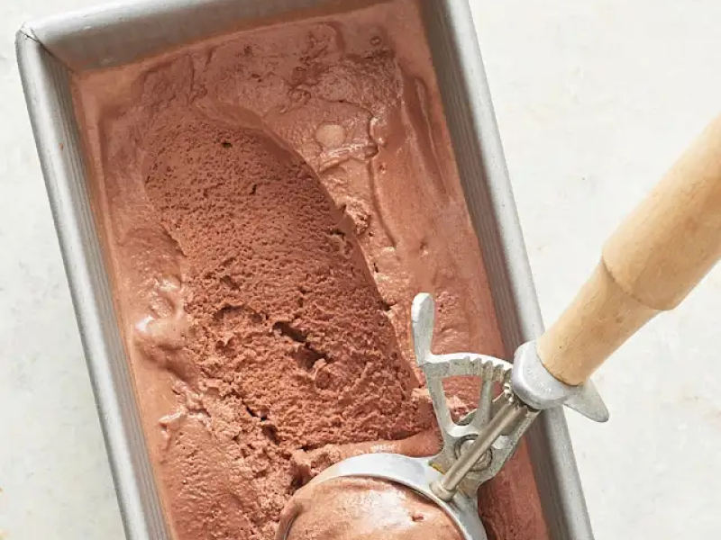 Chocolate ice cream in a freezer safe container.
