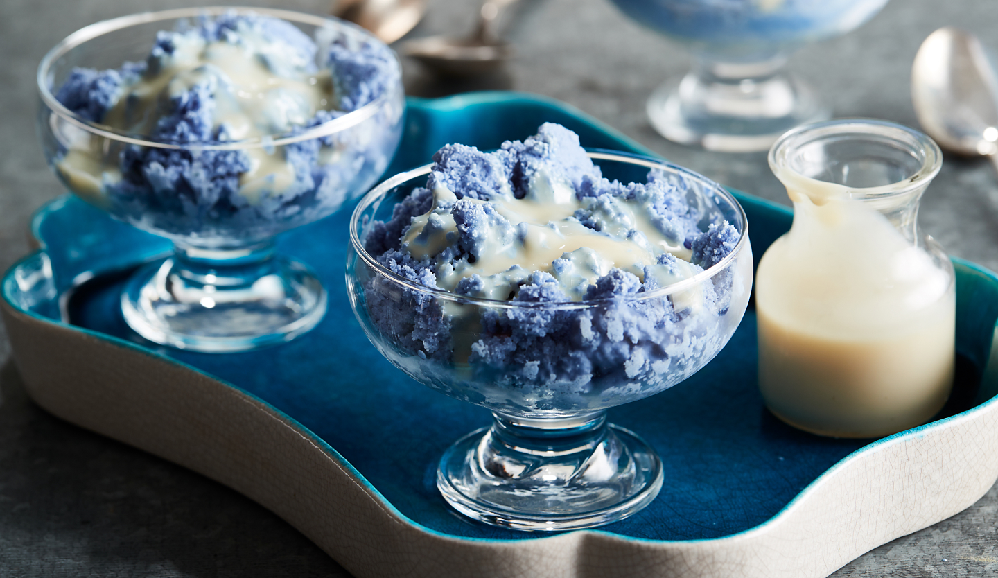 Blue granita topped with sweetened condensed milk 