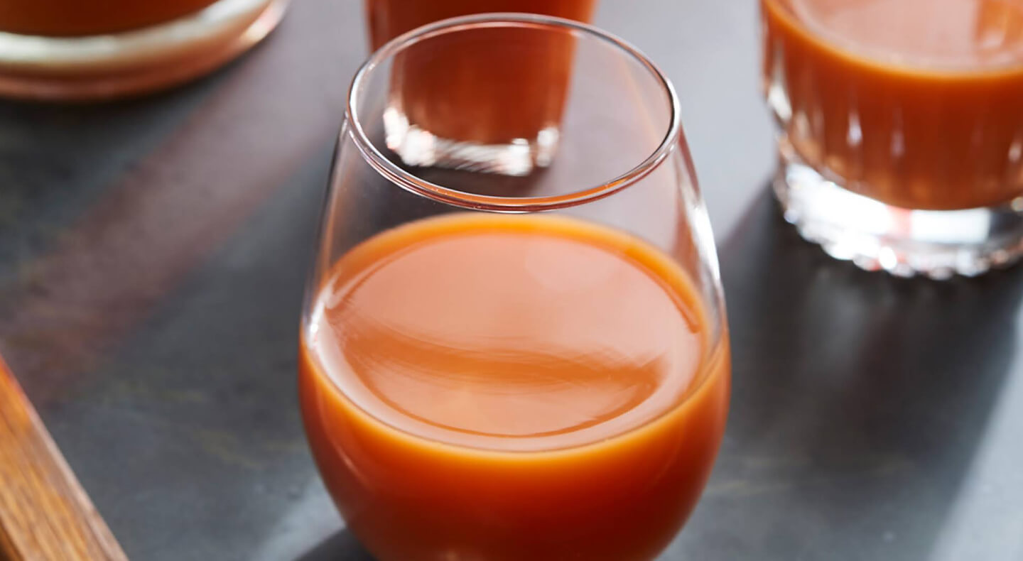 Orange and carrot juice in a stemless glass