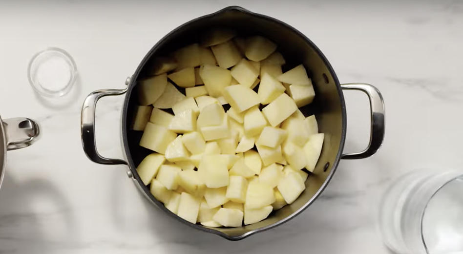 Cubed, peeled potatoes in a large pot