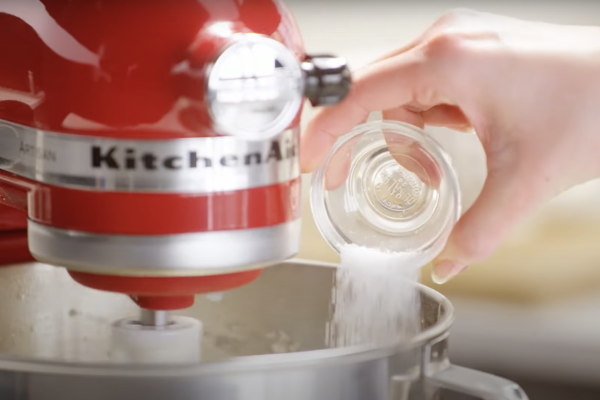 Pouring salt into a stand mixer bowl