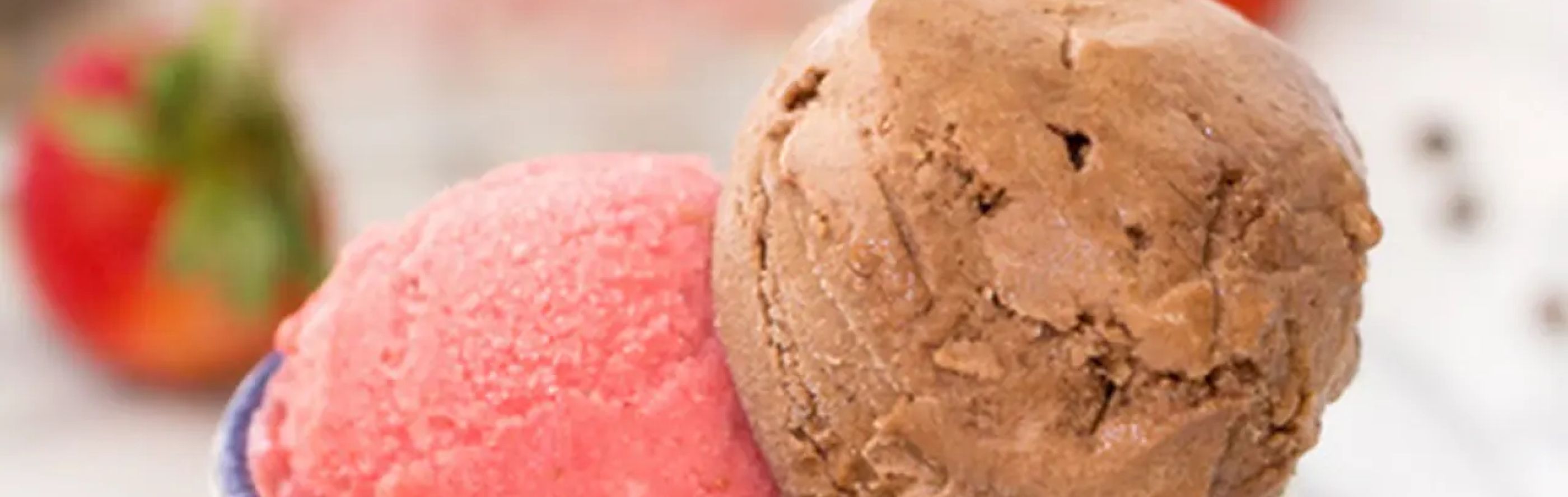 A closeup of a scoop of chocolate and strawberry nice cream