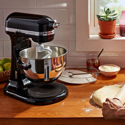 KitchenAid® stand mixer with pasta ingredients on counter