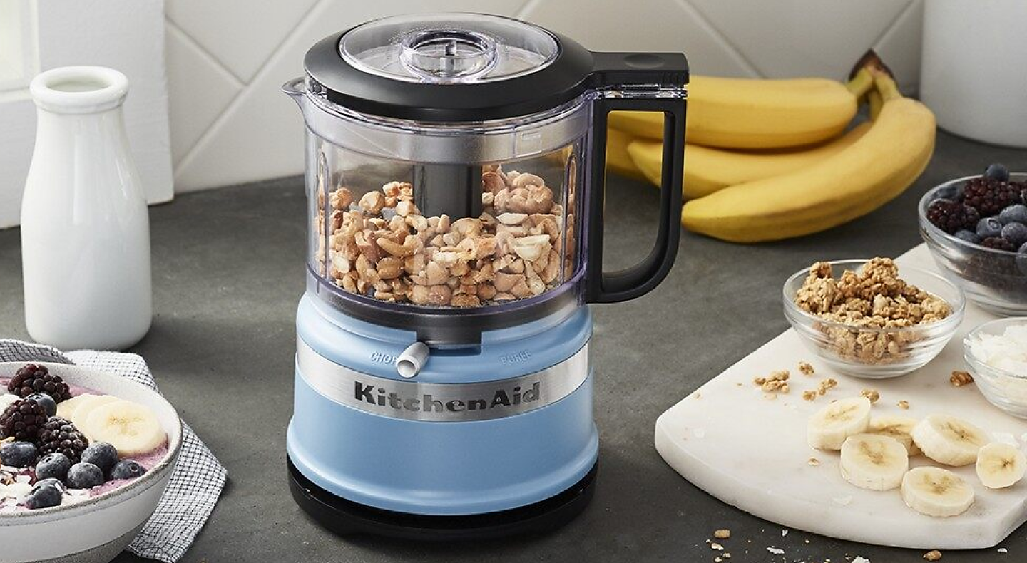 Peanuts inside a blue KitchenAid® food processor