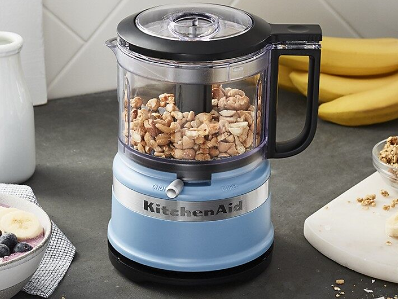 Peanuts inside a blue KitchenAid® food processor