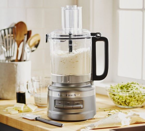 Pie crust ingredients in a food processor on a kitchen counter