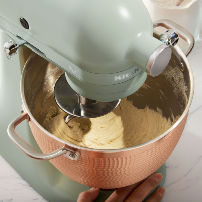 Ingredients being mixed in bowl of  KitchenAid® stand mixer