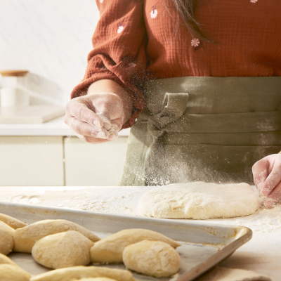 Flour being sprinkled on dough