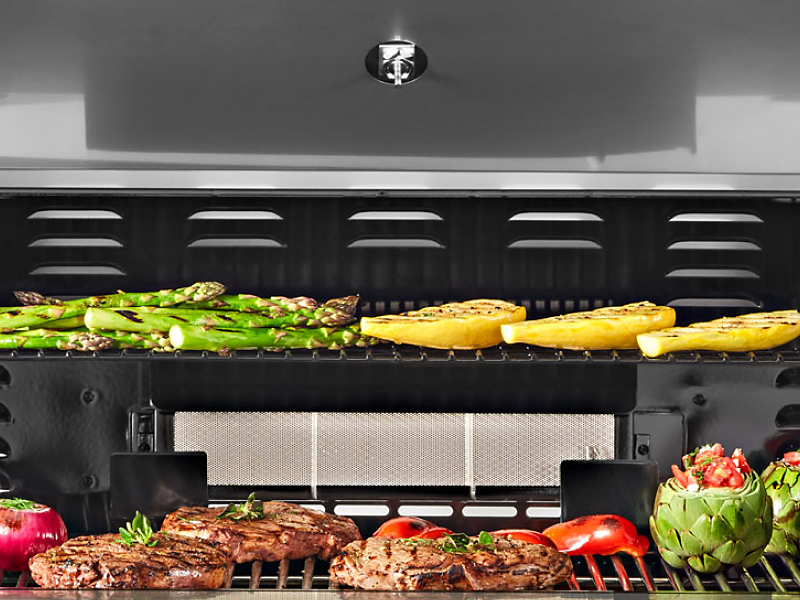 Grill with grilled meats and vegetables
