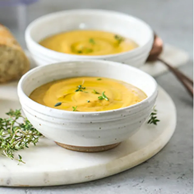 Two bowls of creamy roasted vegetable soup from Yummly recipe
