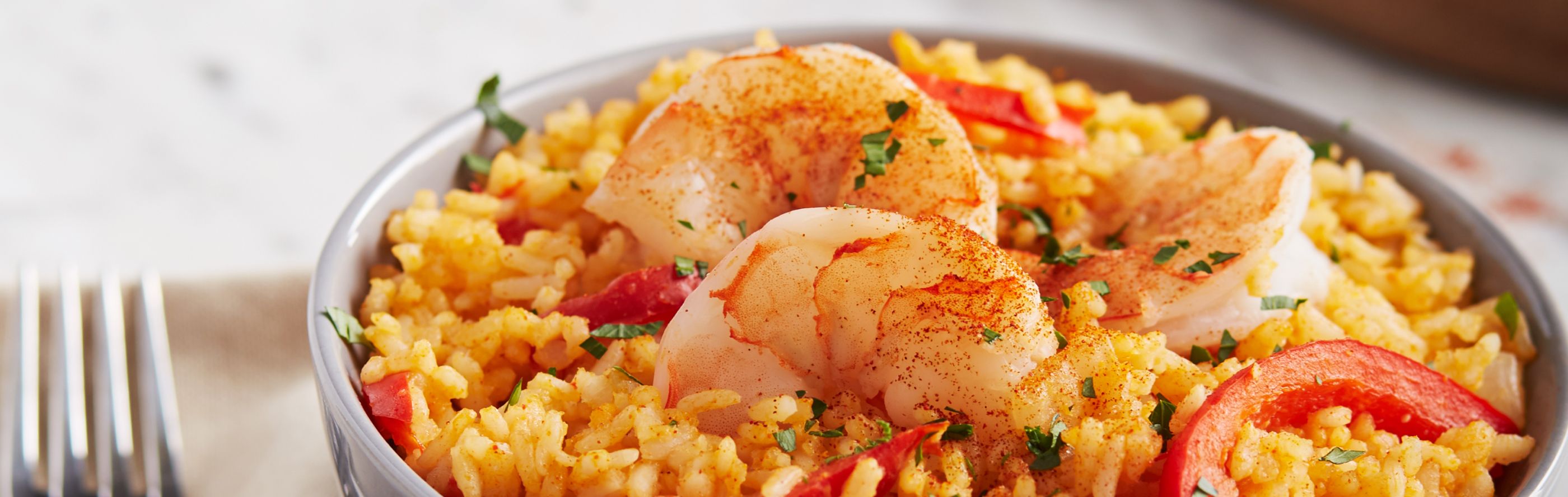 Spanish rice topped with shrimp