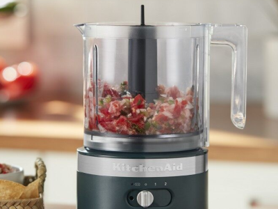 A KitchenAid® food processor filled with tabouli ingredients