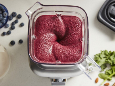 Top view of blender with top open and blended fruit mixture inside